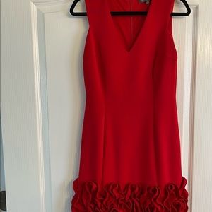Red cocktail dress with rose detail on the hem